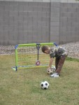 Playing soccer in the back yard!